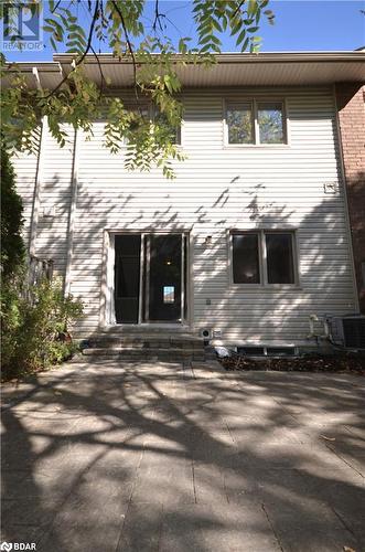 View of back of home featuring a patio and central AC - 175 Stanley Street Unit# 11, Barrie, ON - Outdoor