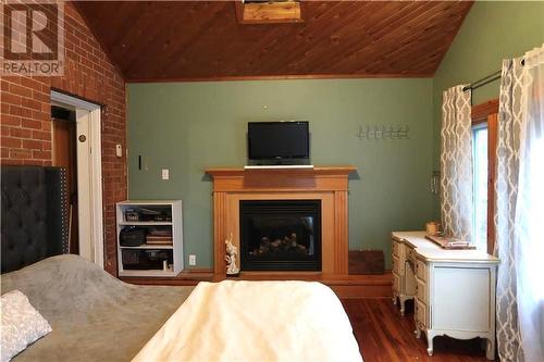 245 Trafalgar Road, Pembroke, ON - Indoor Photo Showing Bedroom With Fireplace