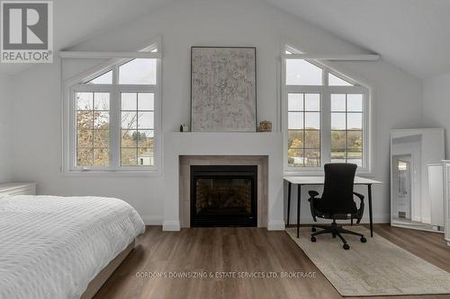 24 - 1098 King Street W, Kingston (Central City West), ON - Indoor Photo Showing Bedroom With Fireplace