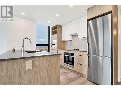 Designer kitchen with  gorgeous views and natural light - 1488 Bertram Street Unit# 3206 Lot# 250, Kelowna, BC - Indoor Photo Showing Kitchen With Upgraded Kitchen