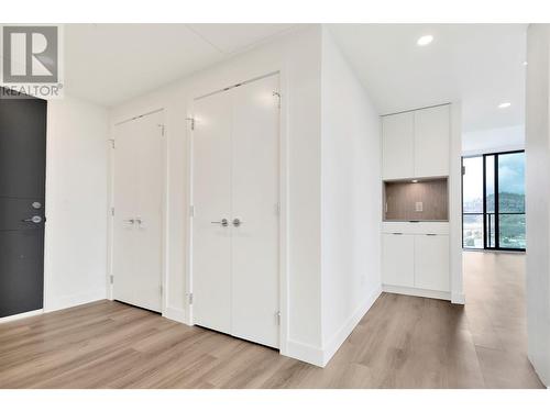 Great storage and a lit display and additional cabinet beside. - 1488 Bertram Street Unit# 3206 Lot# 250, Kelowna, BC - Indoor Photo Showing Other Room