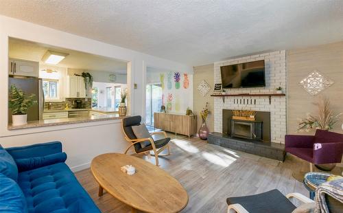 4179 Ashe Crescent, Scotch Creek, BC - Indoor Photo Showing Living Room With Fireplace