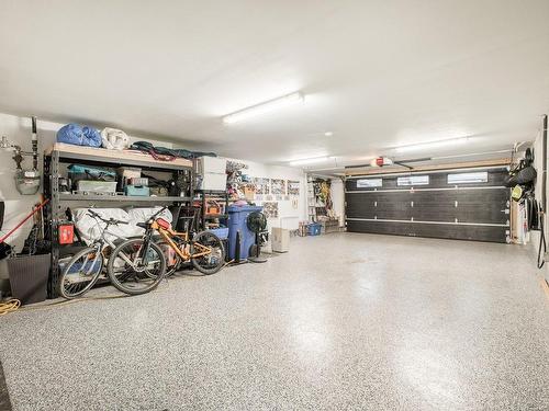 Garage - 7-303 Rue De L'Aigle, Carignan, QC - Indoor Photo Showing Garage