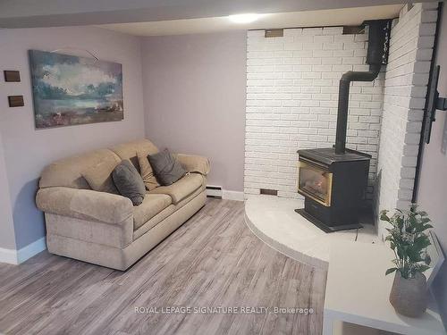 64-700 Harmony Rd N, Oshawa, ON - Indoor Photo Showing Living Room With Fireplace