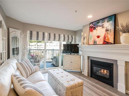 407-5650 Edgewater Lane, Nanaimo, BC - Indoor Photo Showing Living Room With Fireplace