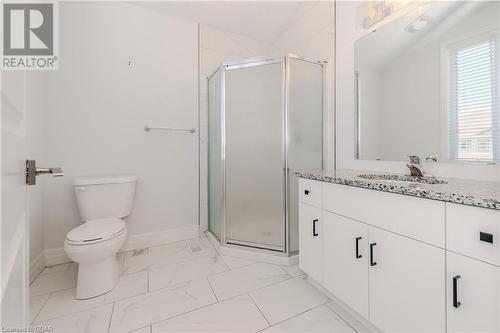 Bathroom featuring vanity, toilet, and a shower with shower door - 1023 Devonshire Avenue Unit# 3, Woodstock, ON - Indoor Photo Showing Bathroom