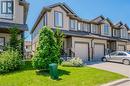 View of front of house with a garage and a front lawn - 1023 Devonshire Avenue Unit# 3, Woodstock, ON  - Outdoor With Facade 