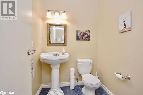 Bathroom with tile patterned flooring, toilet, and sink - 264 Salem Road, Barrie, ON 