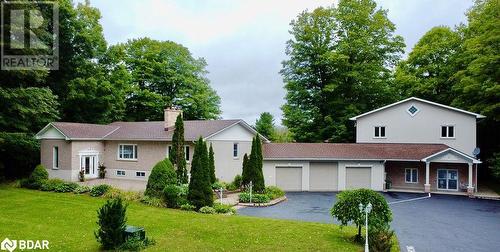 View of front facade with a front lawn and a garage - 264 Salem Road, Barrie, ON 