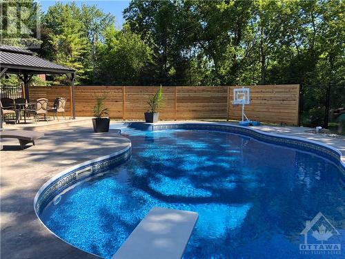 6654 Carolin Court, Ottawa, ON - Outdoor With In Ground Pool With Backyard