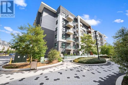 226 - 128 Grovewood Common, Oakville, ON - Outdoor With Balcony With Facade