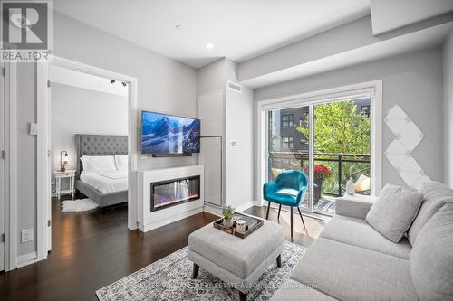 226 - 128 Grovewood Common, Oakville, ON - Indoor Photo Showing Living Room With Fireplace