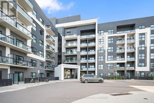 226 - 128 Grovewood Common, Oakville, ON - Outdoor With Balcony With Facade