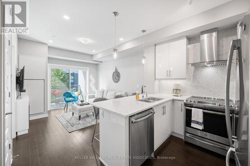 226 - 128 Grovewood Common, Oakville, ON - Indoor Photo Showing Kitchen With Double Sink With Upgraded Kitchen