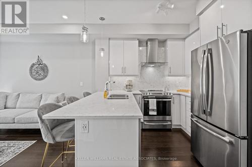 226 - 128 Grovewood Common, Oakville, ON - Indoor Photo Showing Kitchen With Double Sink With Upgraded Kitchen