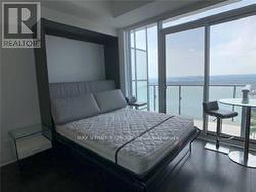 5105 - 1080 Bay Street, Toronto, ON - Indoor Photo Showing Bedroom With Body Of Water