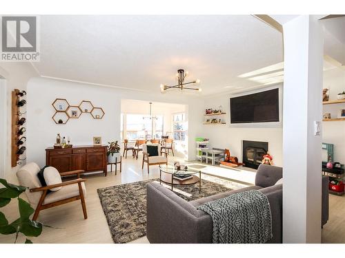 1544 94 Avenue, Dawson Creek, BC - Indoor Photo Showing Living Room With Fireplace