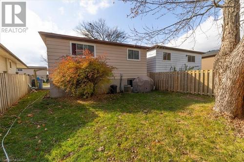 Rear view of property with a lawn - 253 Auden Road, Guelph, ON - Outdoor With Exterior