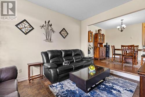 Living room featuring a chandelier - 253 Auden Road, Guelph, ON - Indoor Photo Showing Living Room