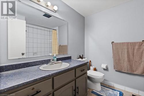 Bathroom with walk in shower, tile patterned flooring, vanity, and toilet - 253 Auden Road, Guelph, ON - Indoor Photo Showing Bathroom