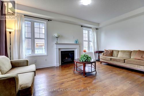 404 Clarkson Gate, Milton, ON - Indoor Photo Showing Living Room With Fireplace