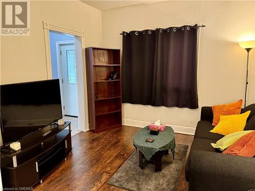 Living room with dark hardwood / wood-style floors - 21 Minto Avenue, Hamilton, ON 