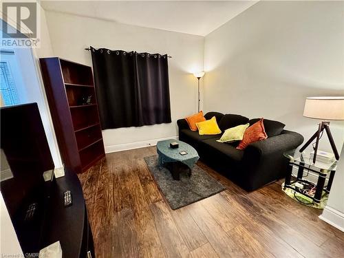 Living room with wood-type flooring - 21 Minto Avenue, Hamilton, ON 