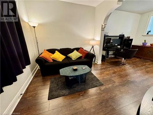 Living room featuring dark hardwood / wood-style flooring - 21 Minto Avenue, Hamilton, ON 