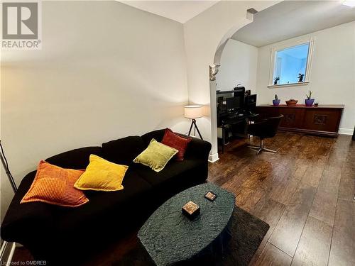 Living room featuring dark hardwood / wood-style flooring - 21 Minto Avenue, Hamilton, ON 