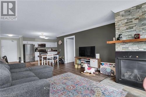 312 - 5 Jacksway Crescent, London, ON - Indoor Photo Showing Living Room With Fireplace