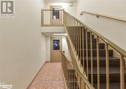 Staircase featuring tile patterned flooring - 