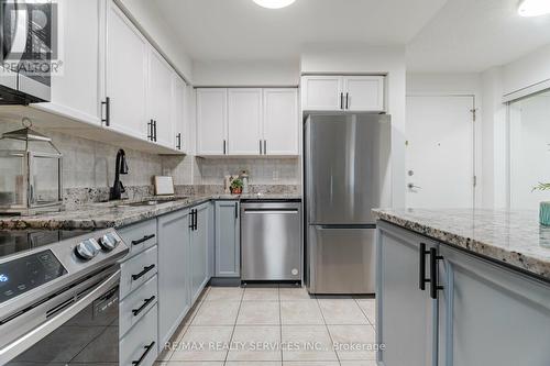 717 - 3880 Duke Of York Boulevard, Mississauga, ON - Indoor Photo Showing Kitchen With Stainless Steel Kitchen With Upgraded Kitchen