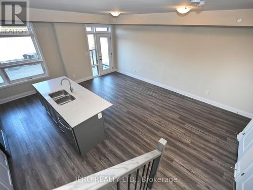 121 - 1573 Rose Way, Milton, ON - Indoor Photo Showing Kitchen With Double Sink