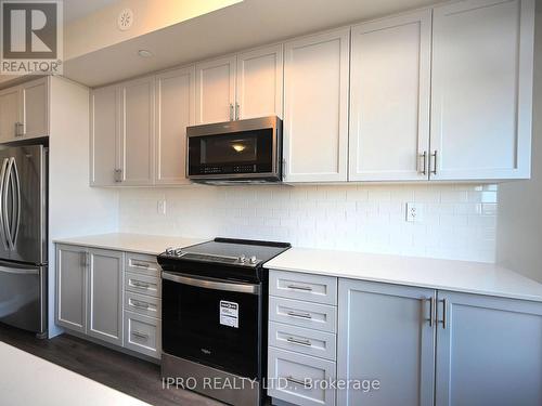 121 - 1573 Rose Way, Milton, ON - Indoor Photo Showing Kitchen