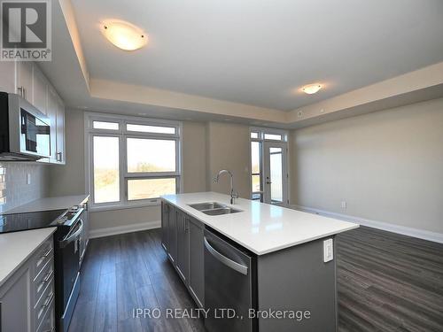 121 - 1573 Rose Way, Milton, ON - Indoor Photo Showing Kitchen With Double Sink