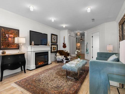 Salon - 8010 Rue De Londres, Brossard, QC - Indoor Photo Showing Living Room With Fireplace