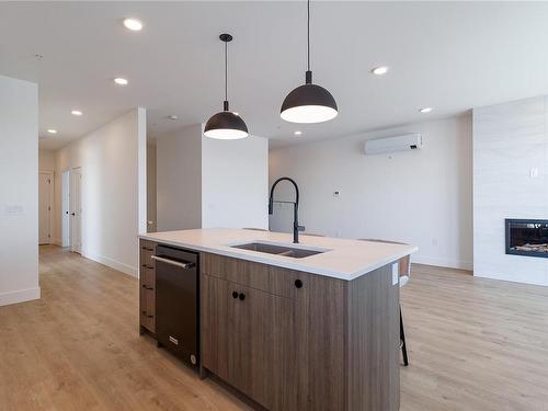 501-201 Dogwood Dr, Ladysmith, BC - Indoor Photo Showing Kitchen With Fireplace With Double Sink