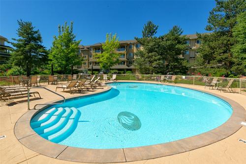 104-1966 Enterprise Way, Kelowna, BC - Outdoor With In Ground Pool With Backyard