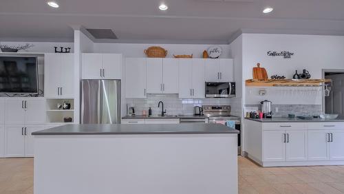 104-1966 Enterprise Way, Kelowna, BC - Indoor Photo Showing Kitchen With Stainless Steel Kitchen