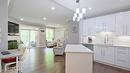 104-1966 Enterprise Way, Kelowna, BC  - Indoor Photo Showing Kitchen With Upgraded Kitchen 