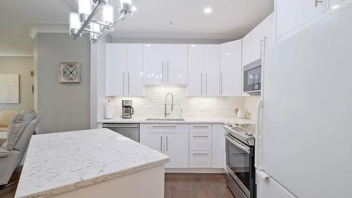 104-1966 Enterprise Way, Kelowna, BC - Indoor Photo Showing Kitchen With Upgraded Kitchen