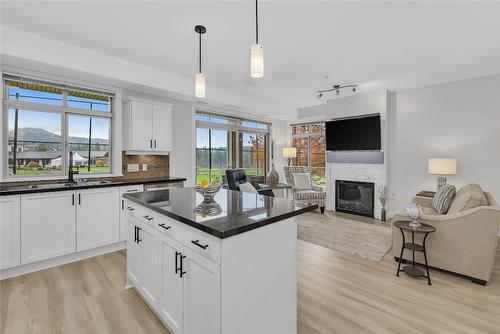 112-3521 Carrington Road, West Kelowna, BC - Indoor Photo Showing Kitchen With Fireplace With Double Sink