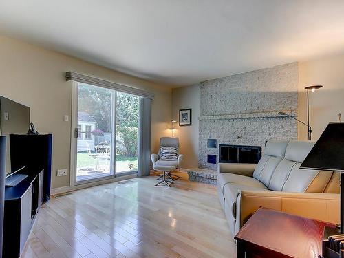 Family room - 560 Rue Duquesne, Saint-Bruno-De-Montarville, QC - Indoor Photo Showing Living Room With Fireplace