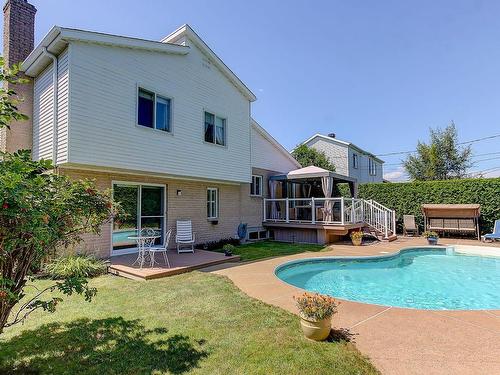 Back facade - 560 Rue Duquesne, Saint-Bruno-De-Montarville, QC - Outdoor With In Ground Pool With Deck Patio Veranda With Exterior