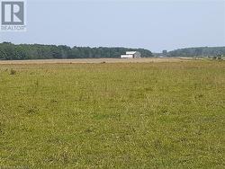 Large pasture field with view of buildings on 200 acre farm. - 