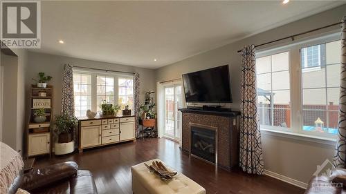 Living Room - 755 Oakglade Avenue, Kanata, ON - Indoor Photo Showing Living Room With Fireplace