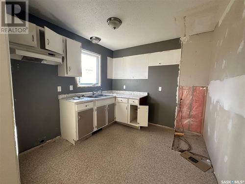 312 Main Street, Lintlaw, SK - Indoor Photo Showing Kitchen With Double Sink