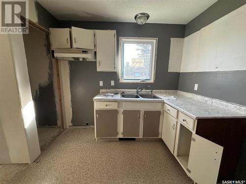 312 Main Street, Lintlaw, SK - Indoor Photo Showing Kitchen With Double Sink