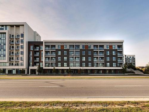 612-95 Dundas St W, Oakville, ON - Outdoor With Balcony With Facade