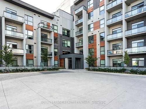 612-95 Dundas St W, Oakville, ON - Outdoor With Balcony With Facade